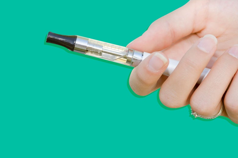 A hand holding a vape pen.